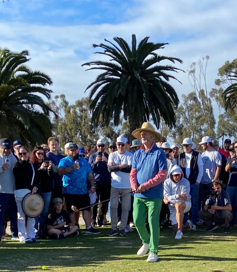Group of People on a Golf Course Watching Bill Murray