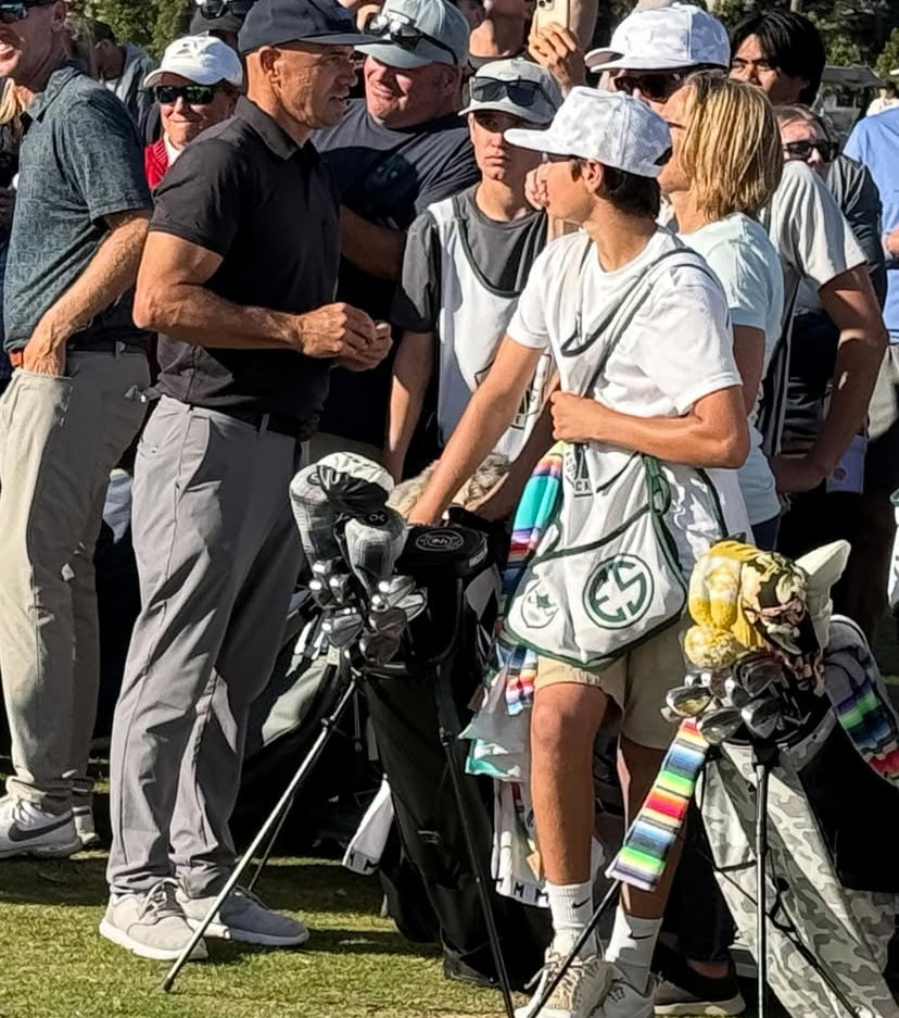 Golf Caddies and Golfers on a Golf Course