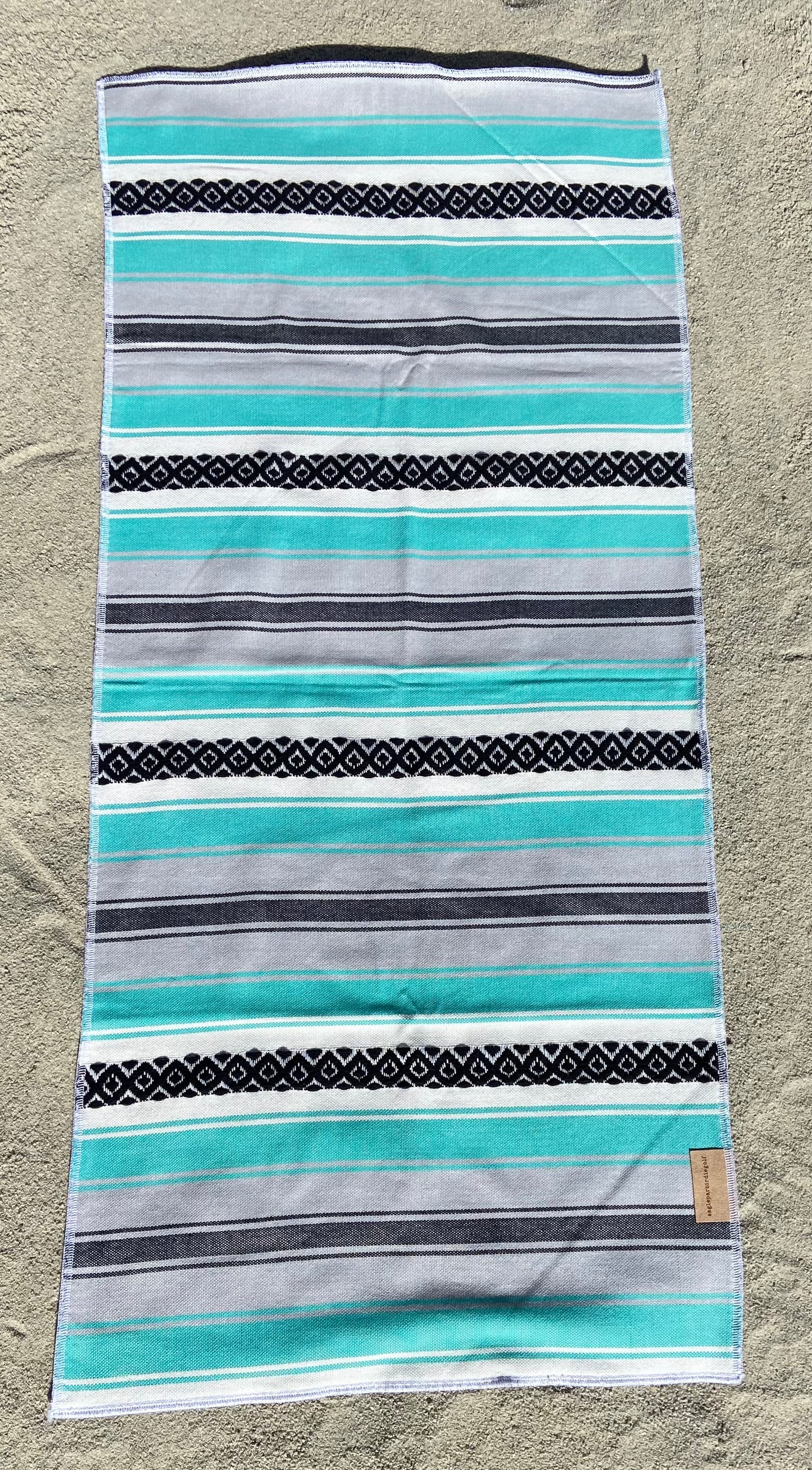 Teal Baja Surf Golf Caddy Towel on Sand