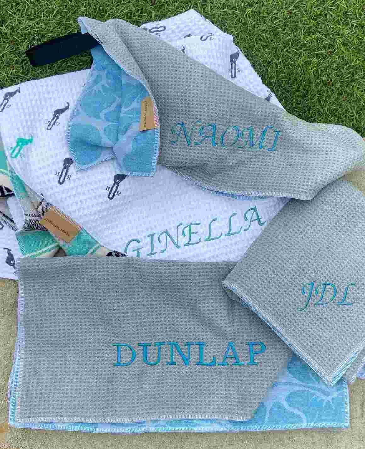 Stack of Colorful Golf Towels with Embroidered Names