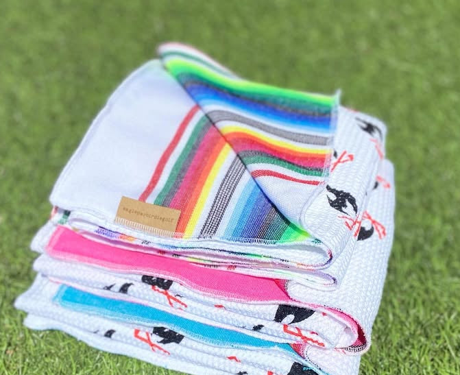 Stack of Folded Sarape Golf Towels on Grass