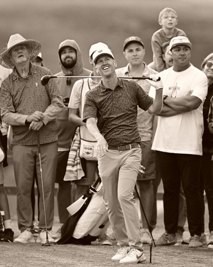 Golfers looking a ball 